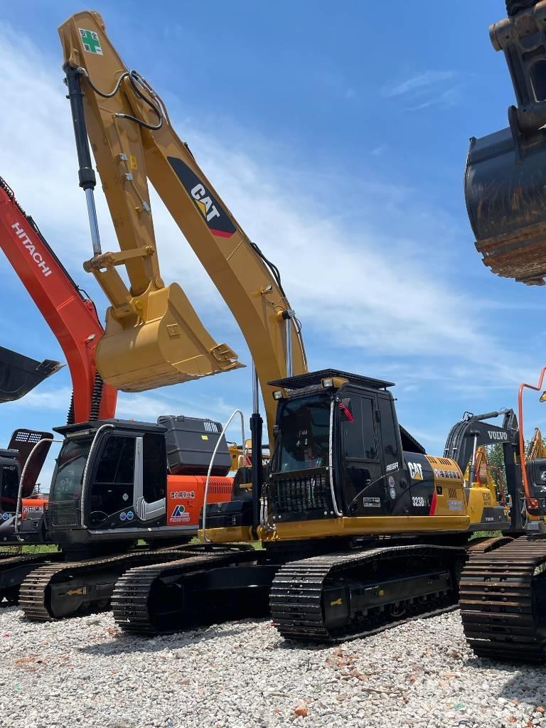 CAT 323 Rupsgraafmachines