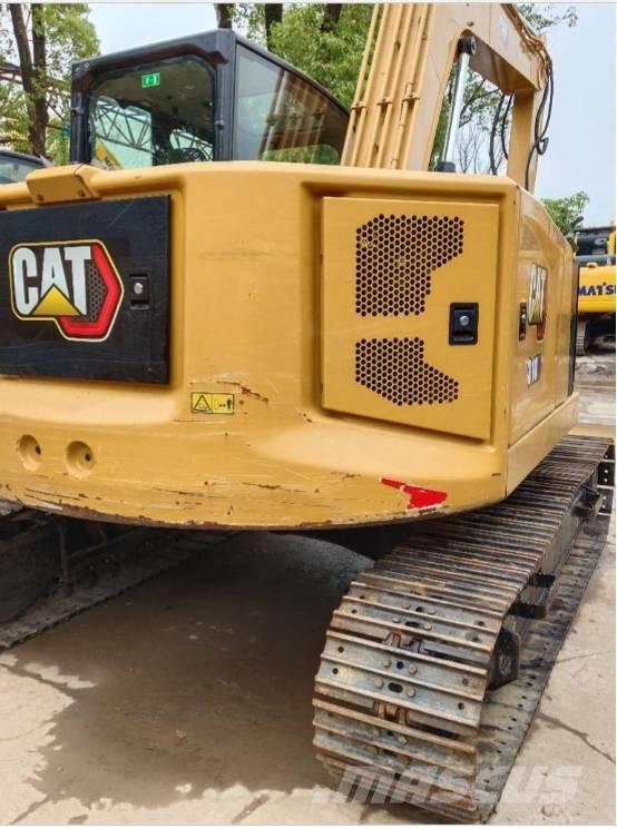 CAT 310 Rupsgraafmachines