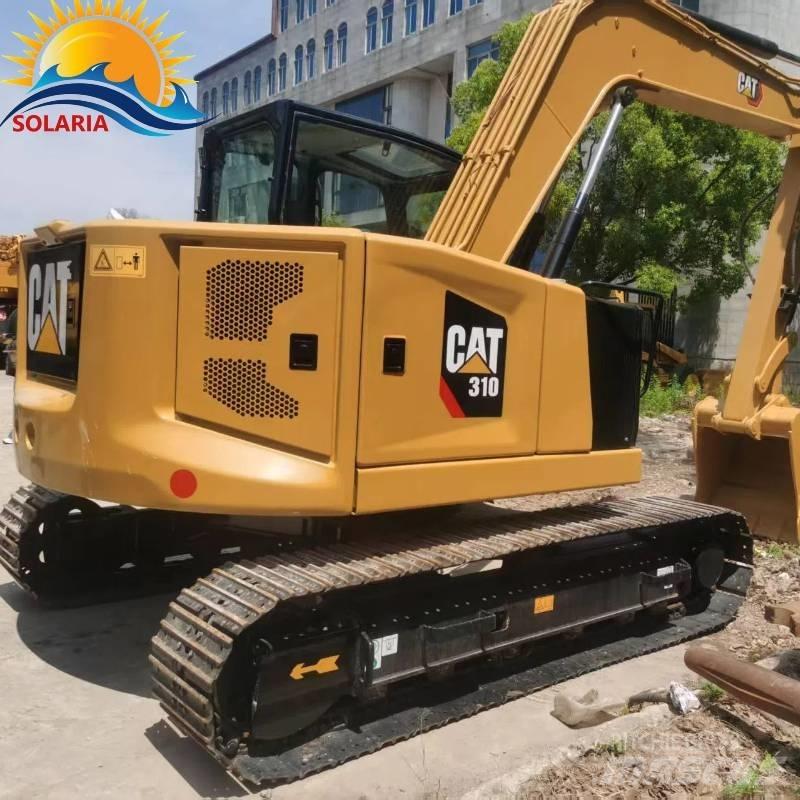 CAT 310 Rupsgraafmachines
