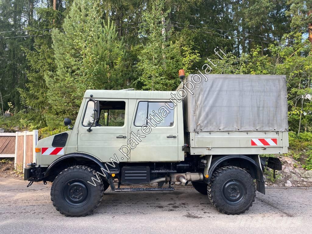 Unimog U 1250L DoKa Schuifzeilopbouw