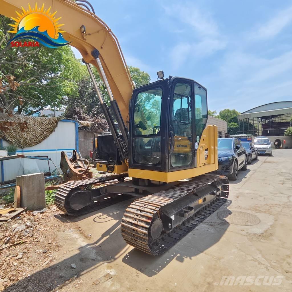 CAT 310 Rupsgraafmachines