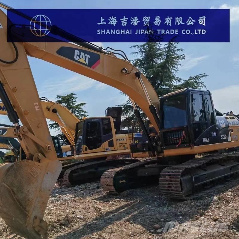 CAT 323 Rupsgraafmachines