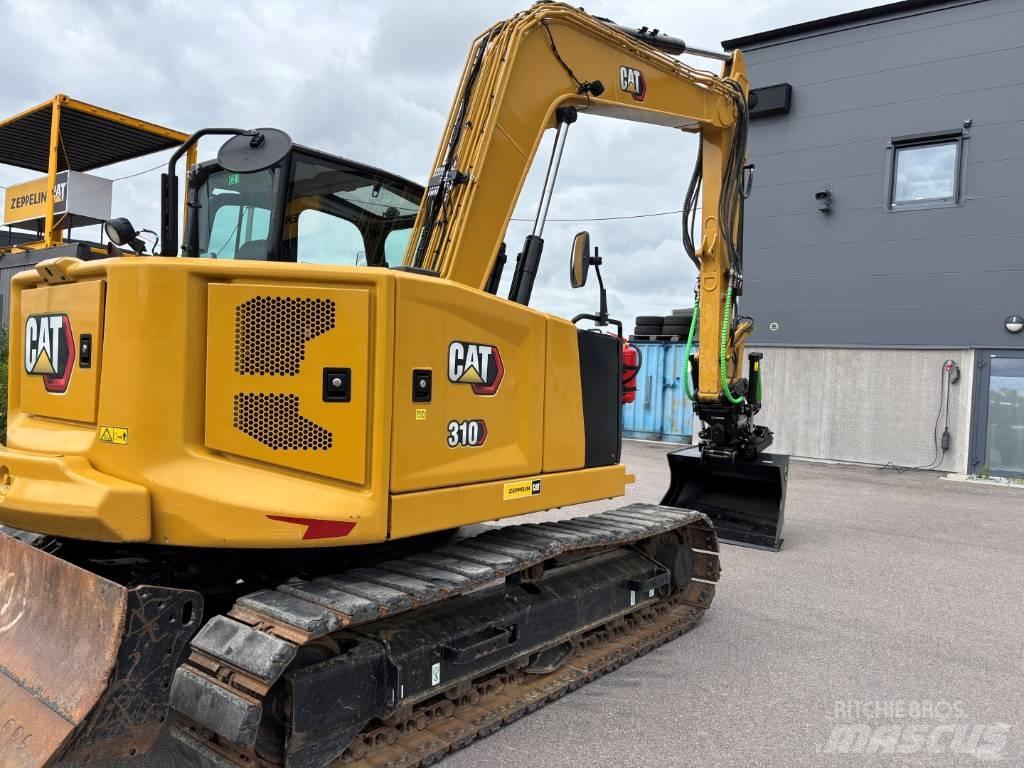 CAT 310 Rupsgraafmachines