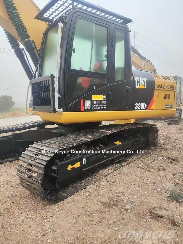 CAT 323 Rupsgraafmachines