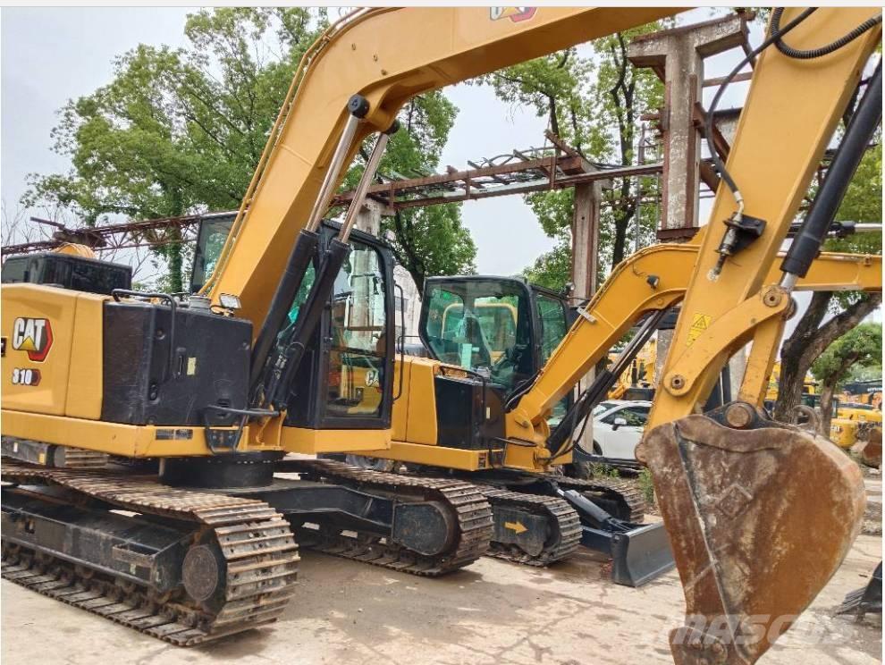 CAT 310 Rupsgraafmachines