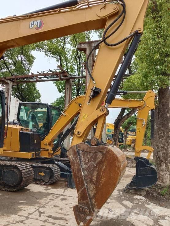 CAT 310 Rupsgraafmachines