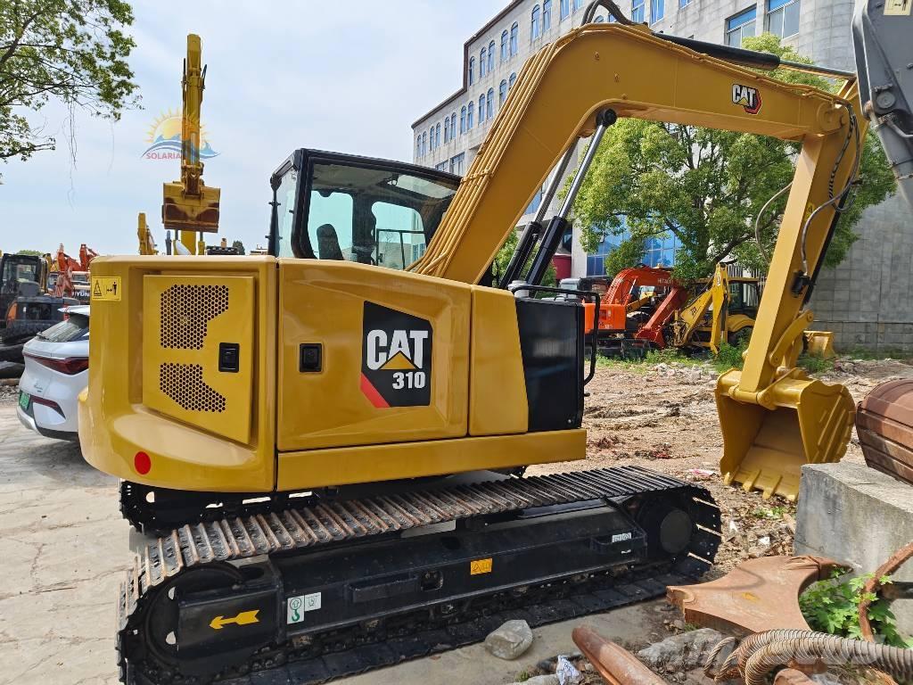 CAT 310 Rupsgraafmachines