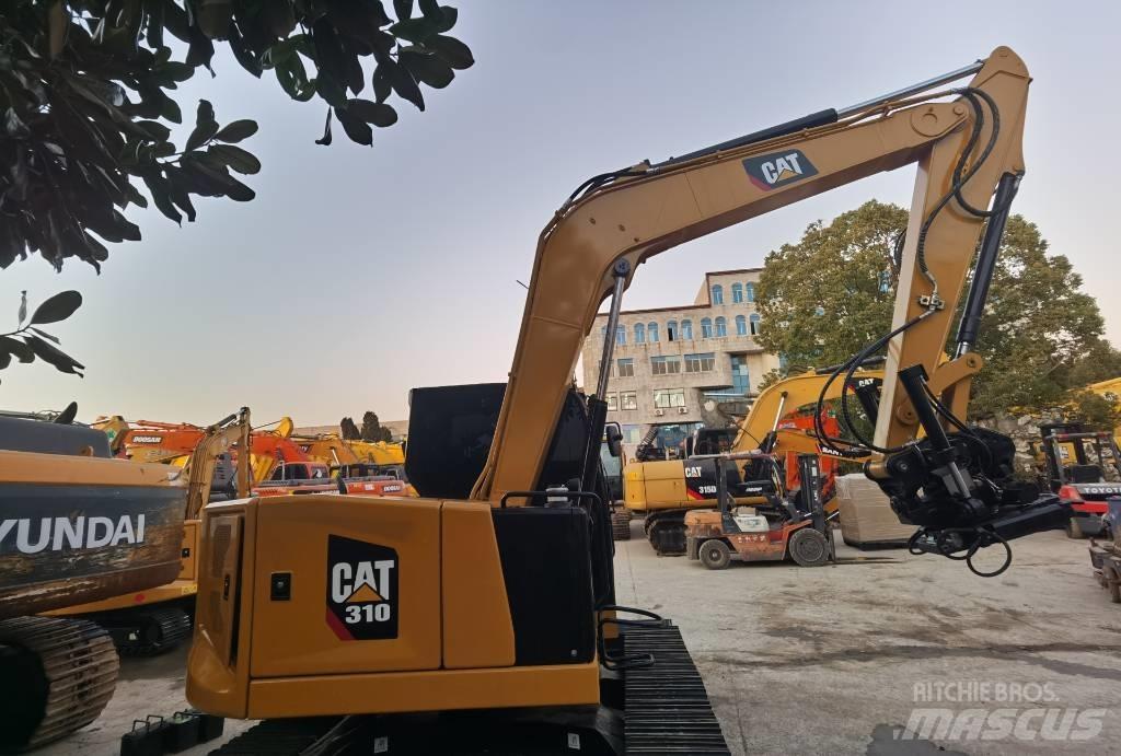 CAT 310 Rupsgraafmachines