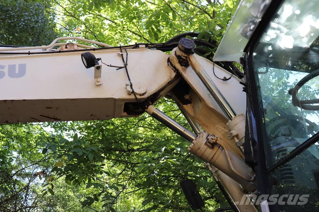 Komatsu PW 140-7 Graaf-laadcombinaties