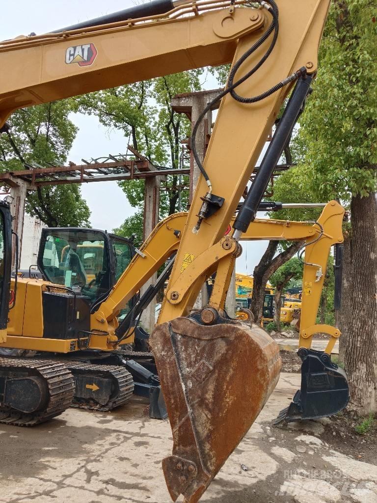 CAT 310 Rupsgraafmachines