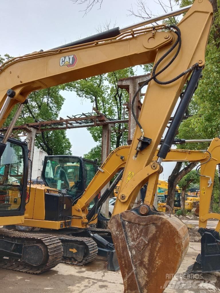 CAT 310 Rupsgraafmachines