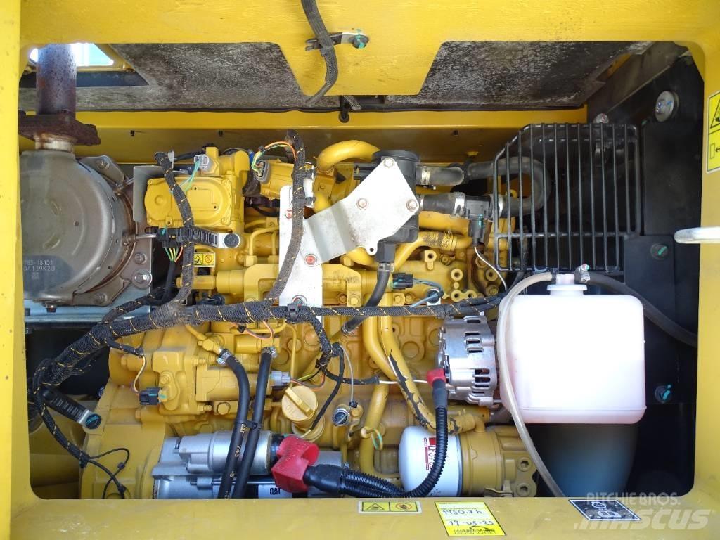 CAT 310 Rupsgraafmachines