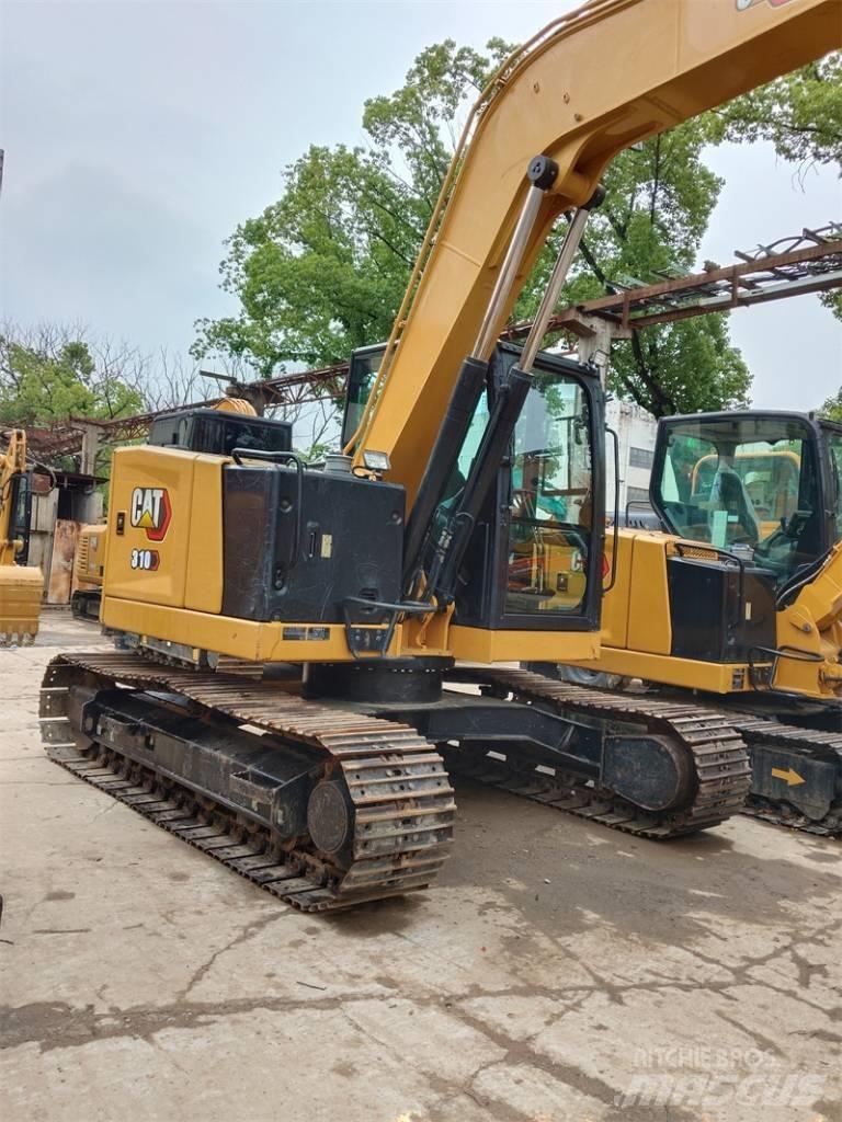 CAT 310 Rupsgraafmachines