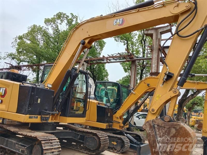 CAT 310 Rupsgraafmachines