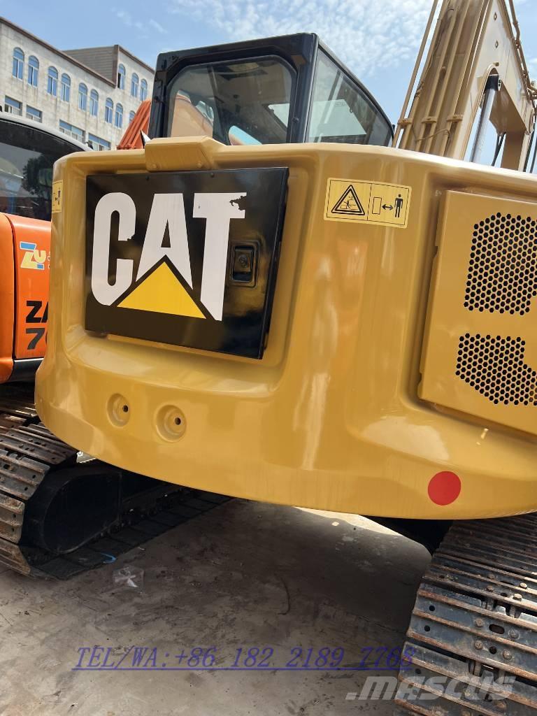 CAT 310 Rupsgraafmachines