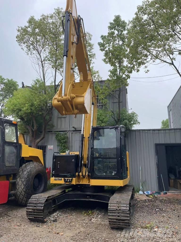 CAT 310 Rupsgraafmachines
