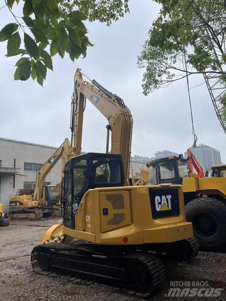 CAT 310 Rupsgraafmachines