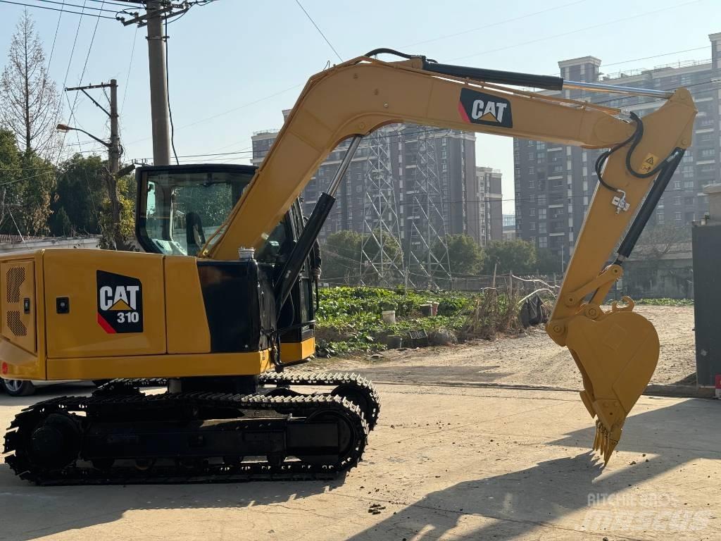 CAT 310 Rupsgraafmachines
