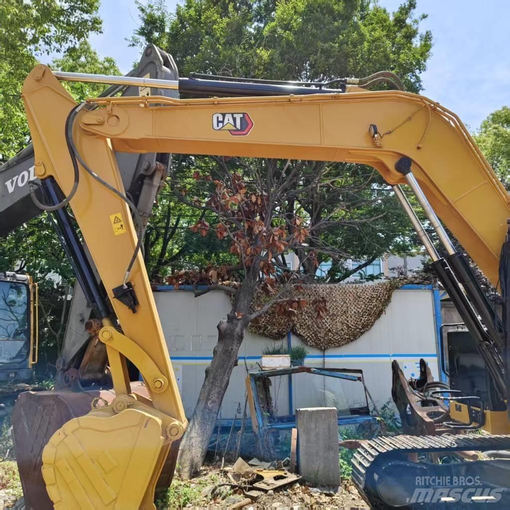 CAT 310 Rupsgraafmachines