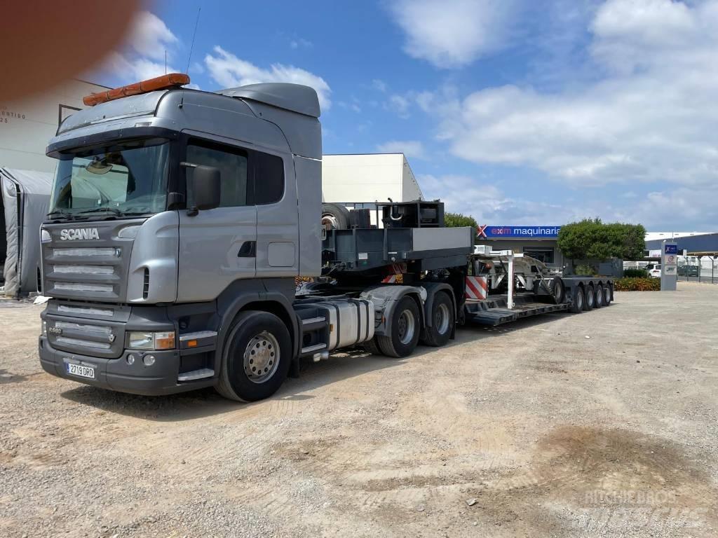 Scania R 580 Vrachtwagen met vlakke laadvloer en lier