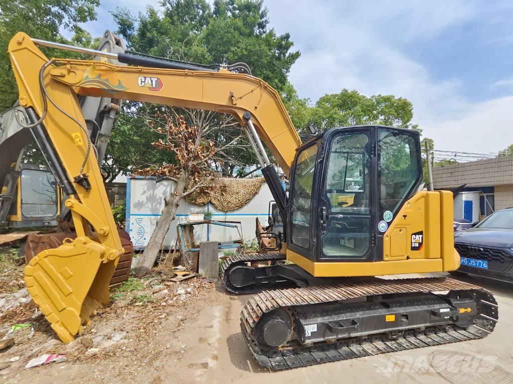 CAT 310 Rupsgraafmachines