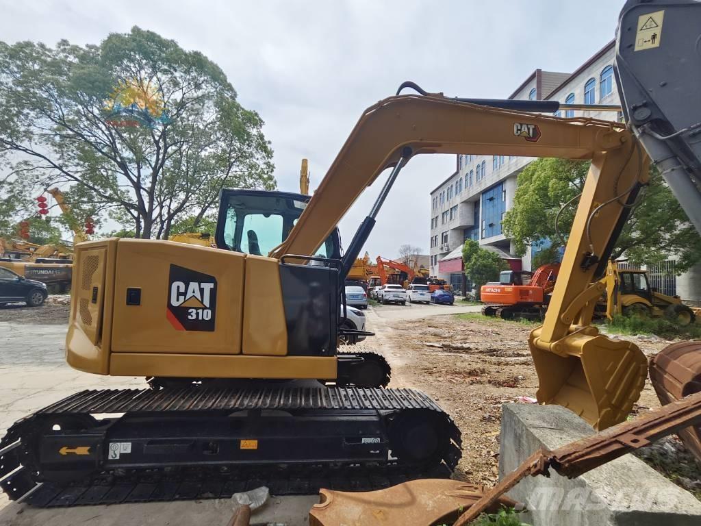 CAT 310 Rupsgraafmachines