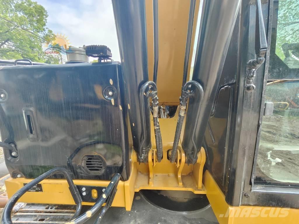 CAT 310 Rupsgraafmachines