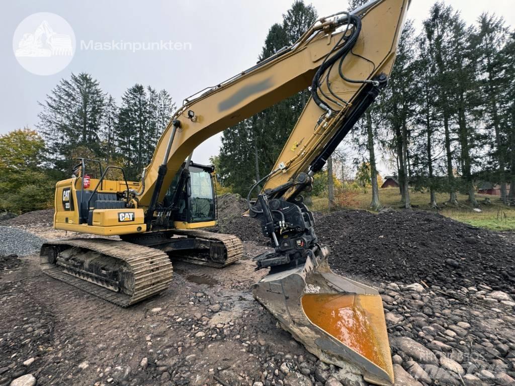CAT 323 Rupsgraafmachines