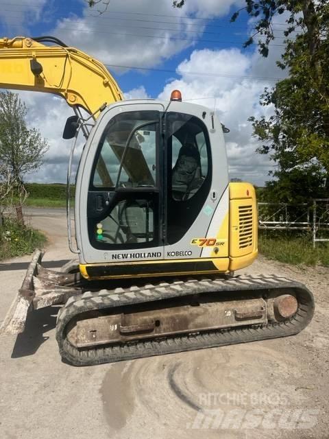 New Holland E 70 SR Midigraafmachines 7t - 12t