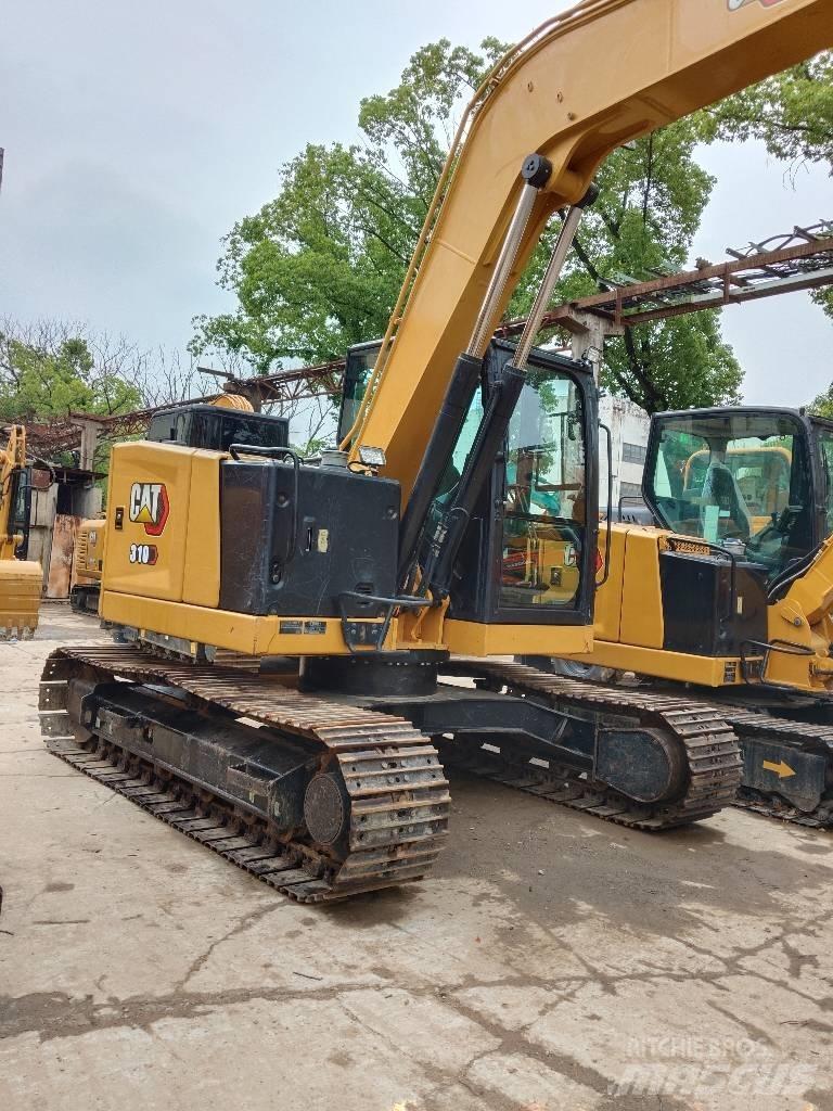 CAT 310 Rupsgraafmachines
