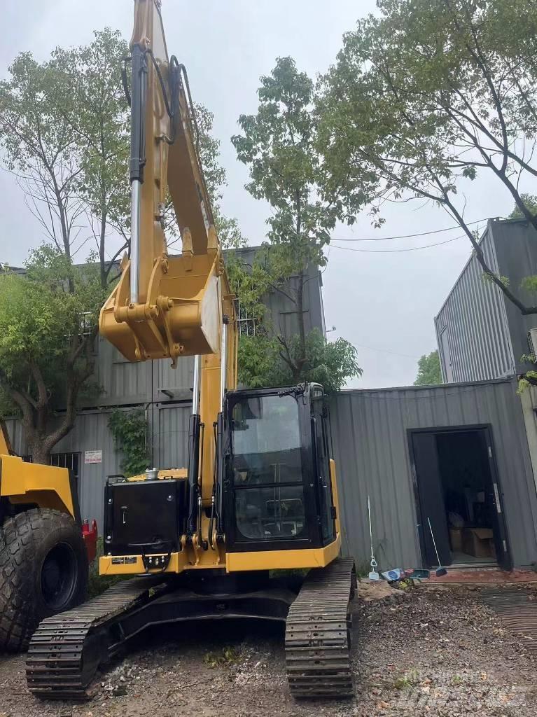 CAT 310 Rupsgraafmachines