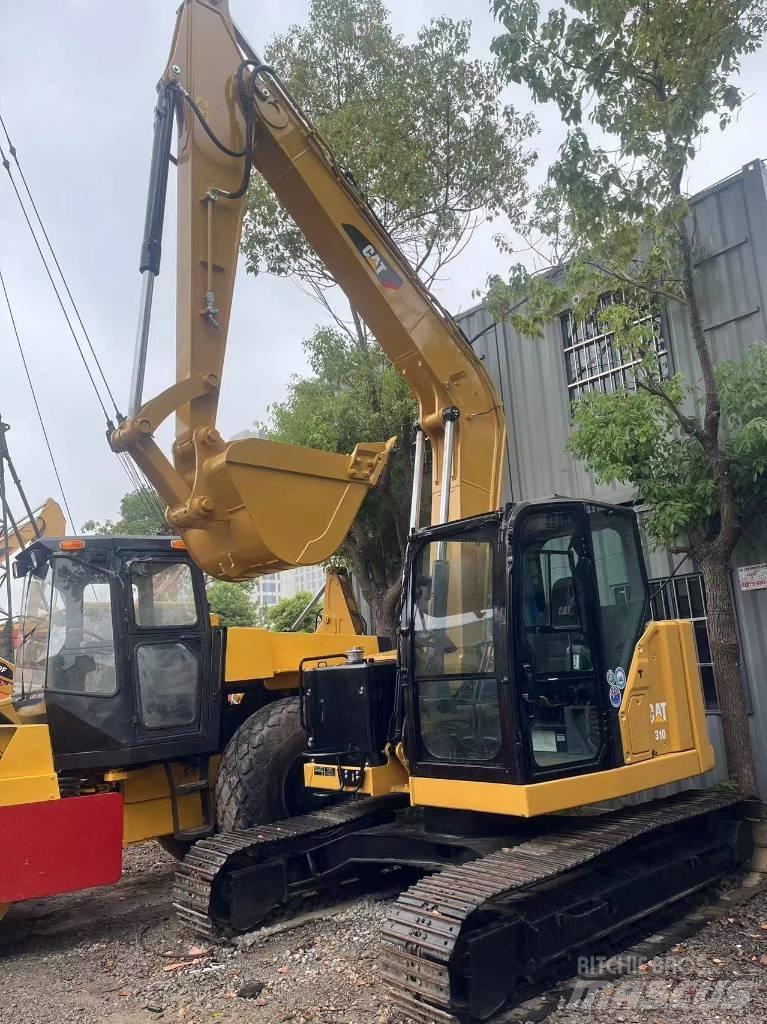 CAT 310 Rupsgraafmachines