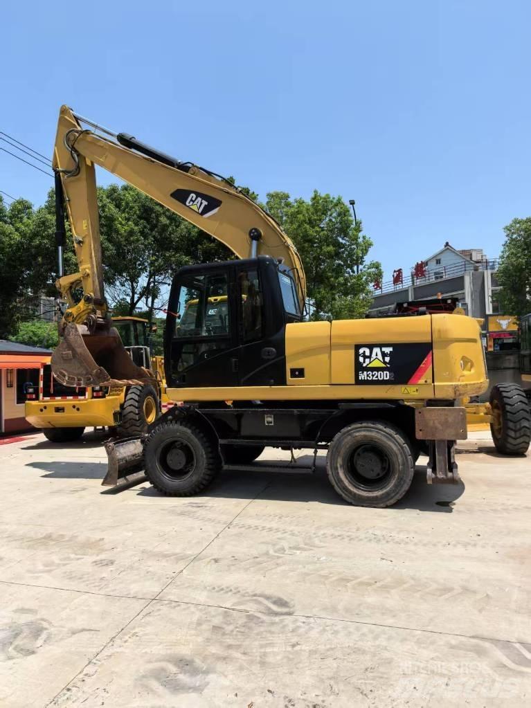CAT M 320 Wielgraafmachines