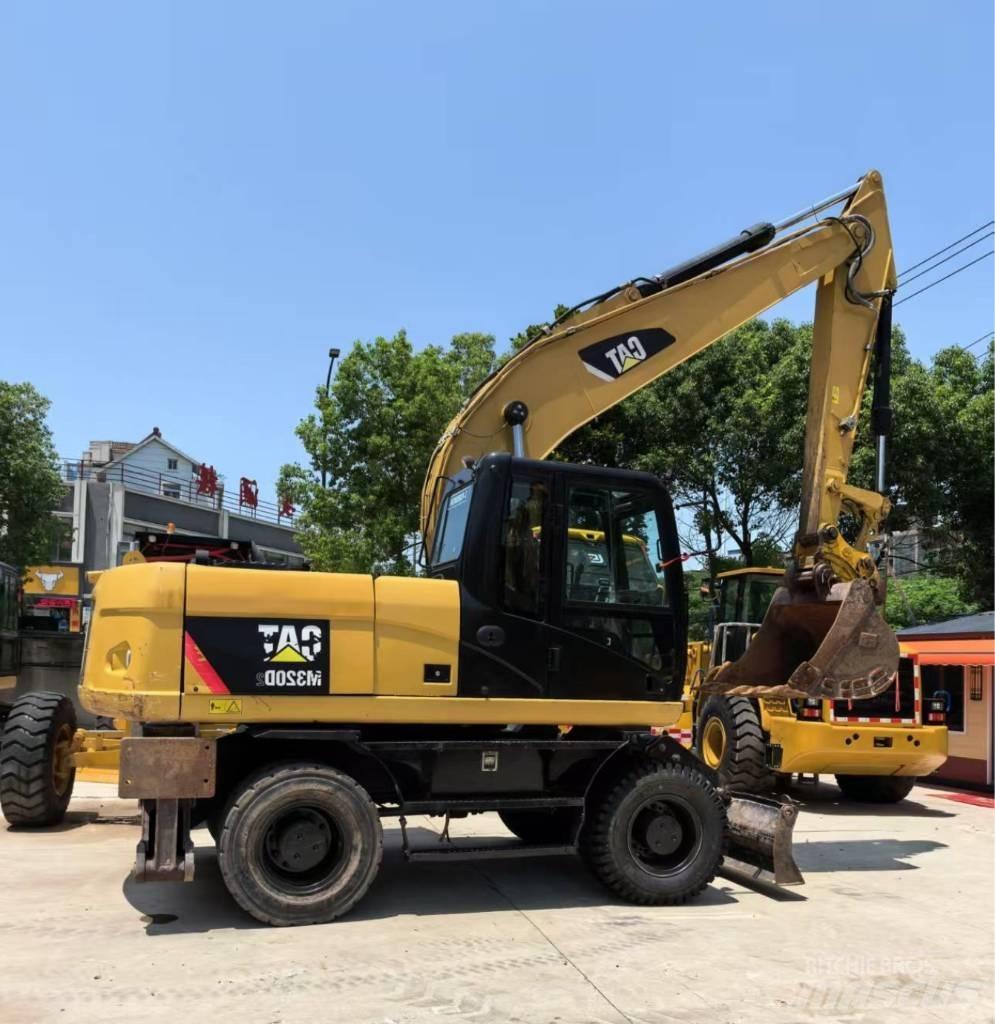 CAT M 320 Wielgraafmachines