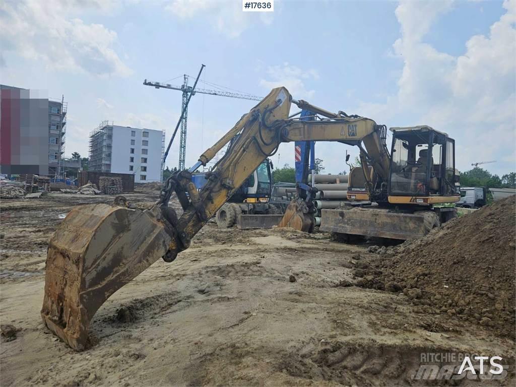 CAT M312 Wielgraafmachines