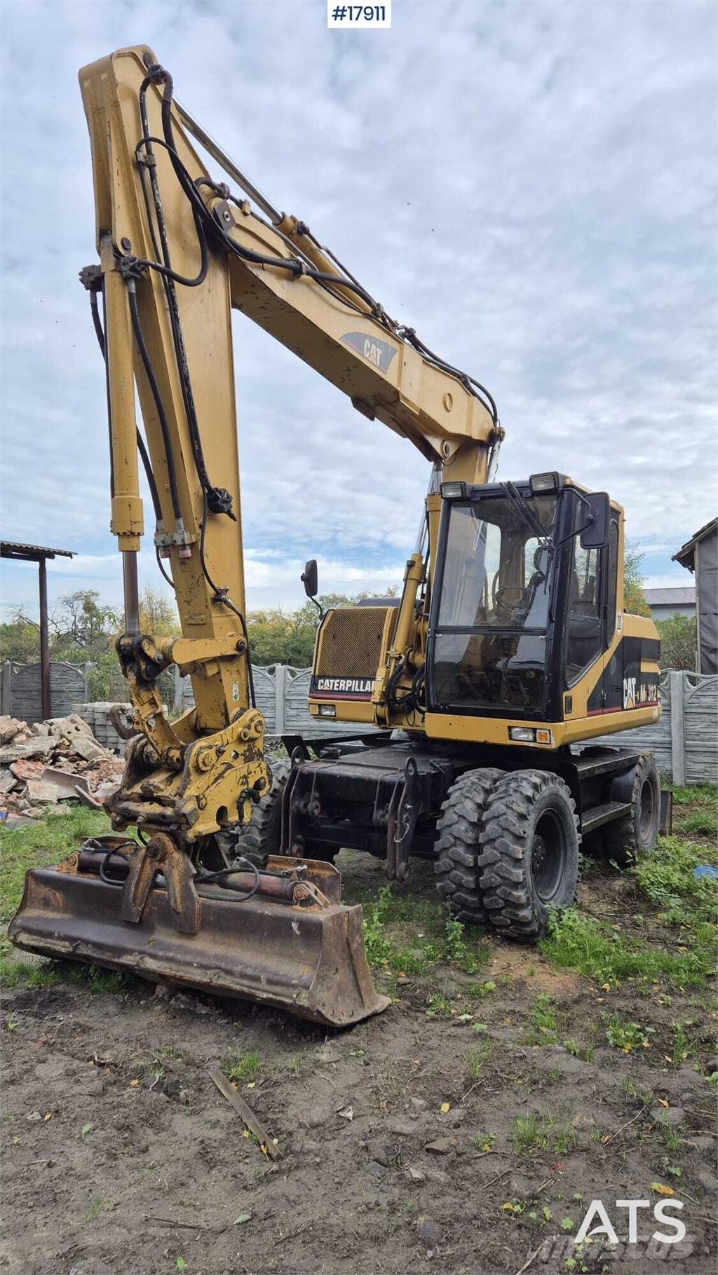 CAT M312 Wielgraafmachines