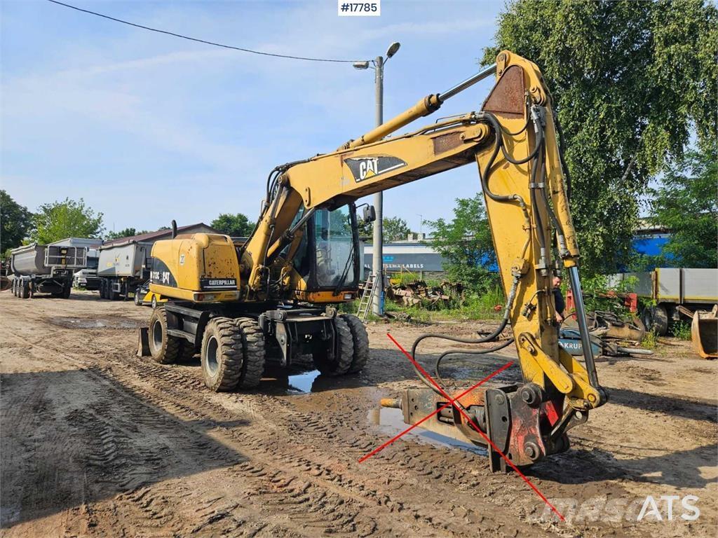 CAT M313 C Wielgraafmachines