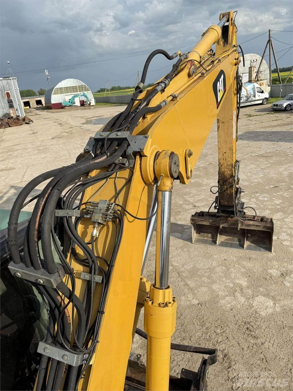 CAT M315C Wielgraafmachines