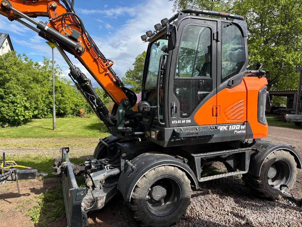 Develon DX 100 W-7 Wielgraafmachines