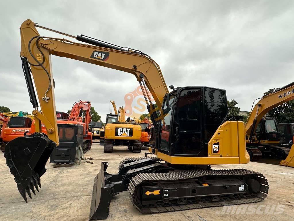 CAT 310 Rupsgraafmachines