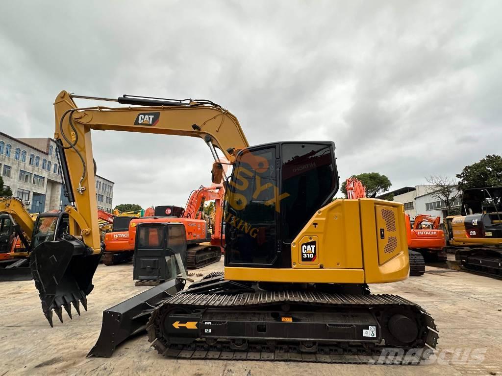 CAT 310 Rupsgraafmachines