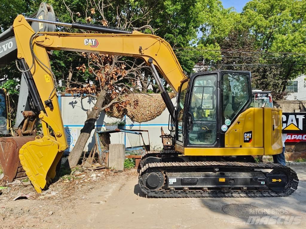 CAT 310 Rupsgraafmachines