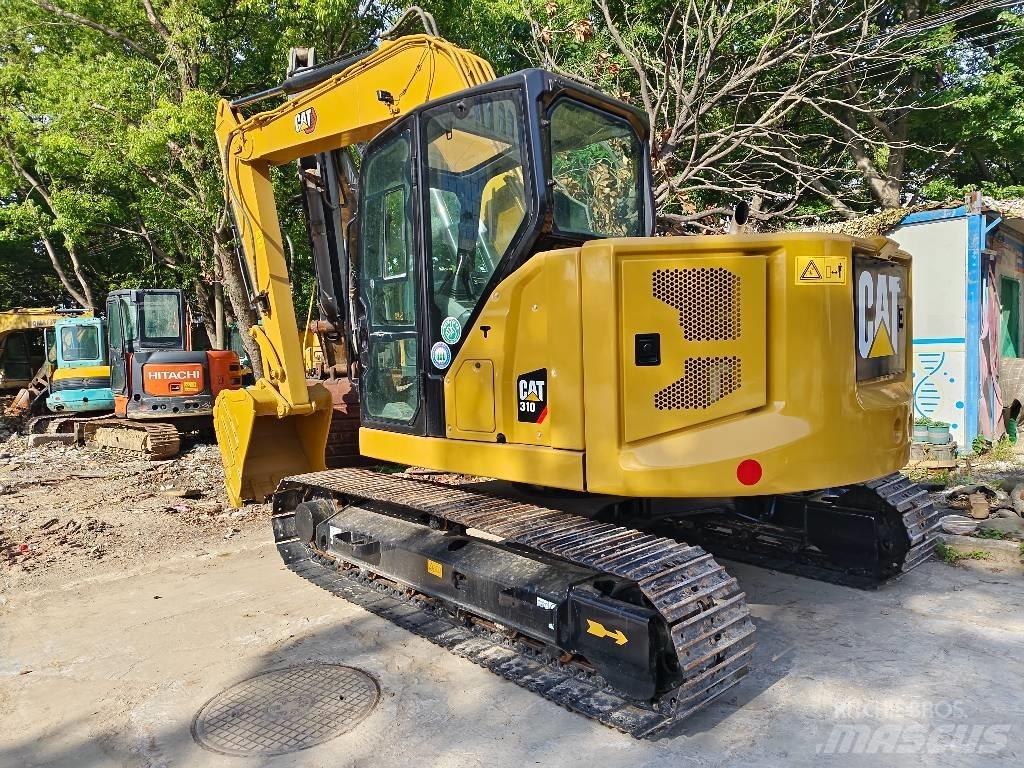 CAT 310 Rupsgraafmachines