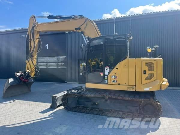 CAT 310 Rupsgraafmachines