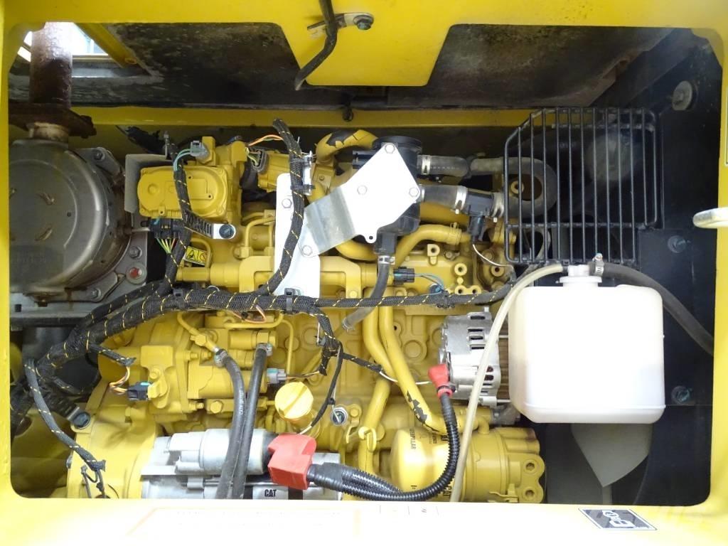 CAT 310 Rupsgraafmachines