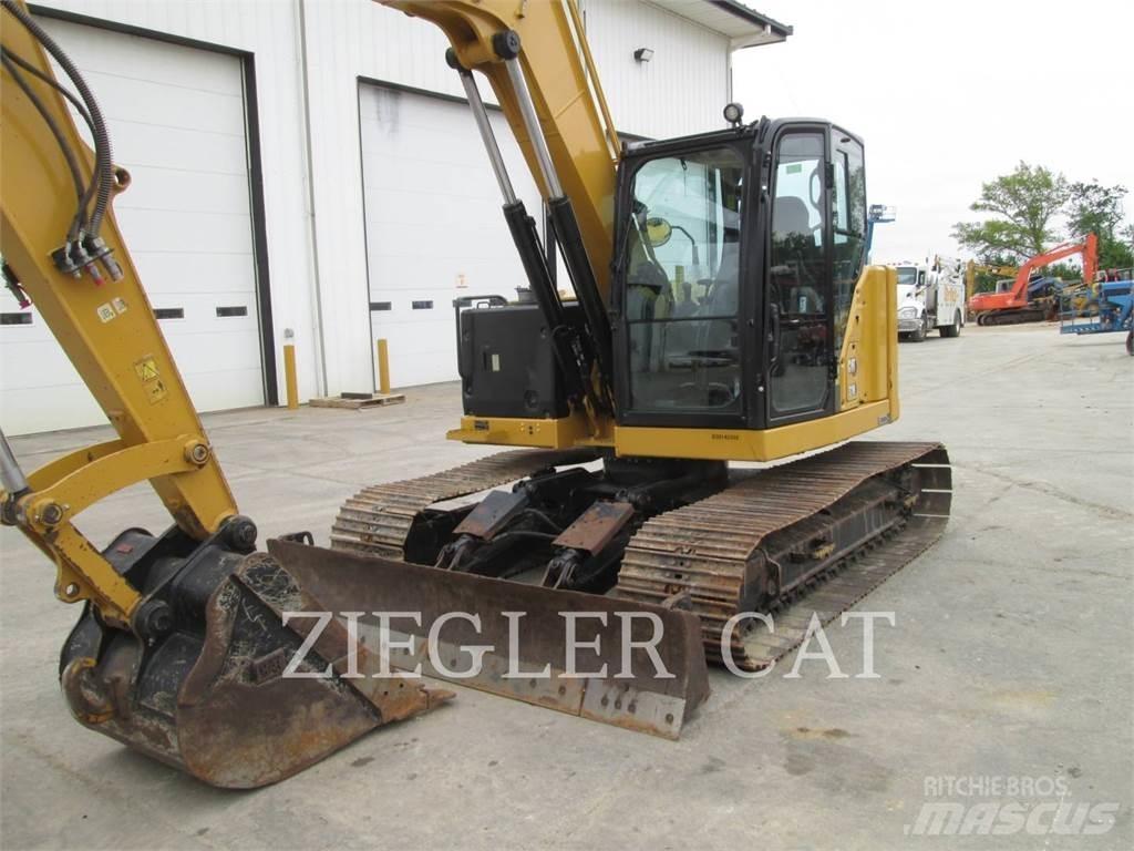 CAT 310 Rupsgraafmachines