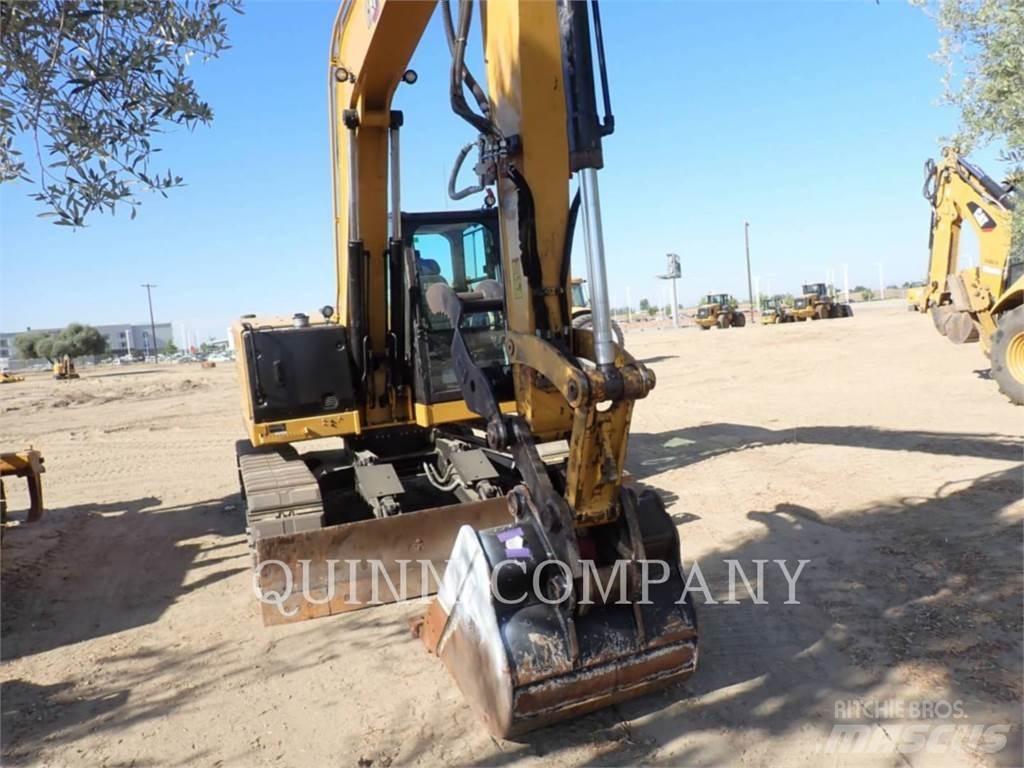 CAT 310 Rupsgraafmachines
