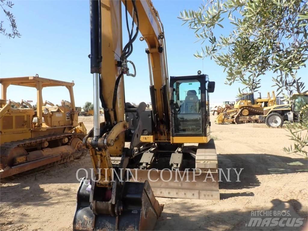 CAT 310 Rupsgraafmachines
