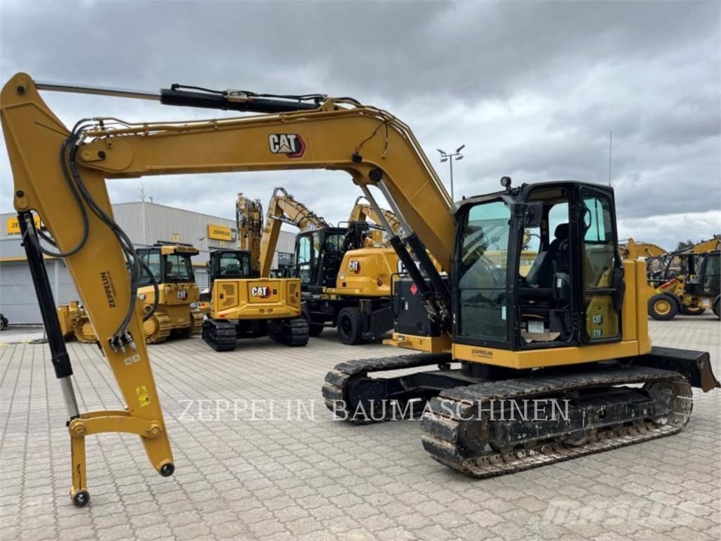 CAT 310 Rupsgraafmachines