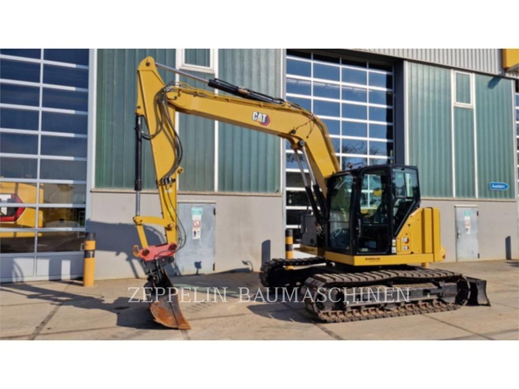 CAT 310 Rupsgraafmachines